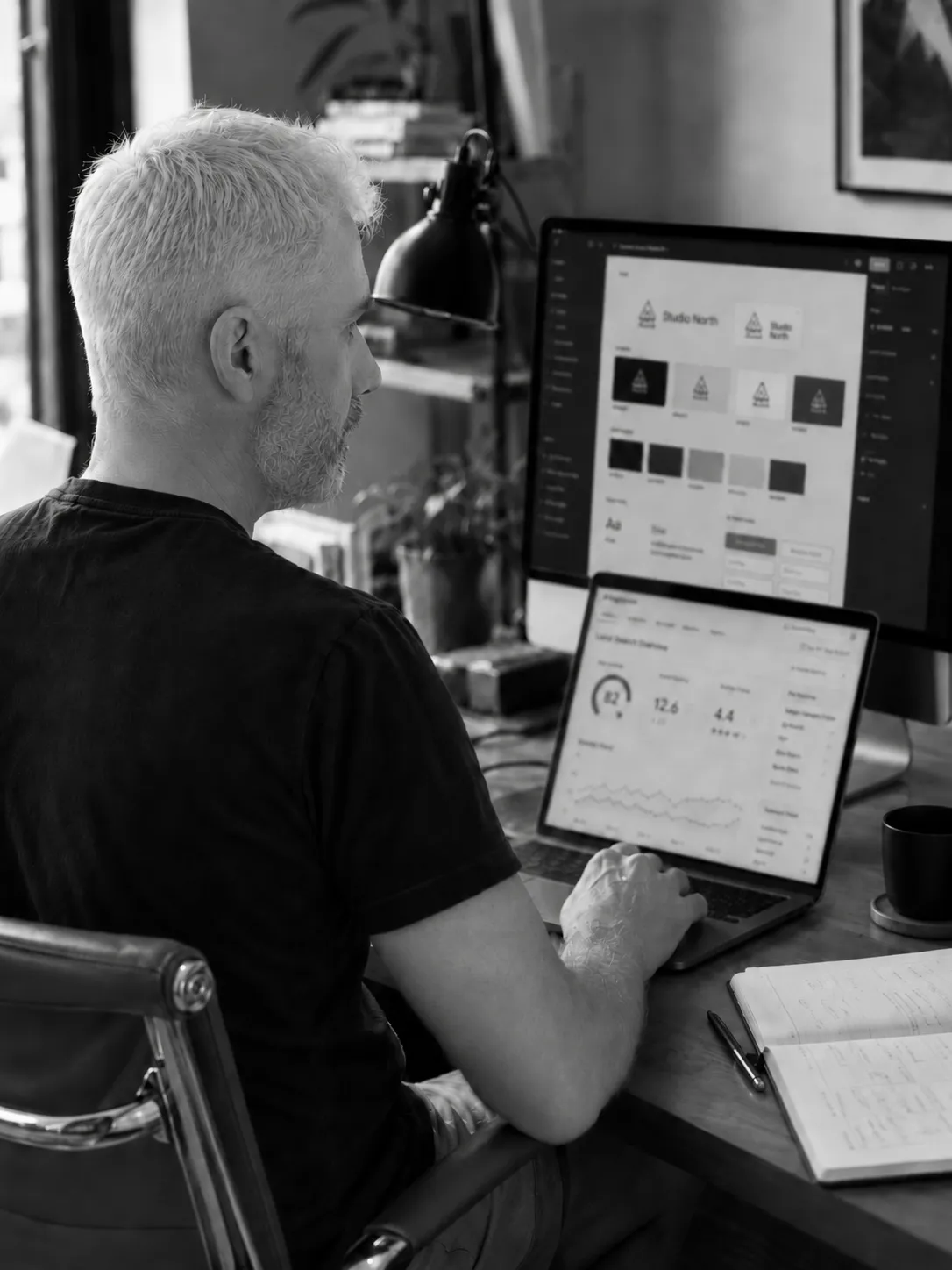 Gareth Parsons reviewing digital work at a desk